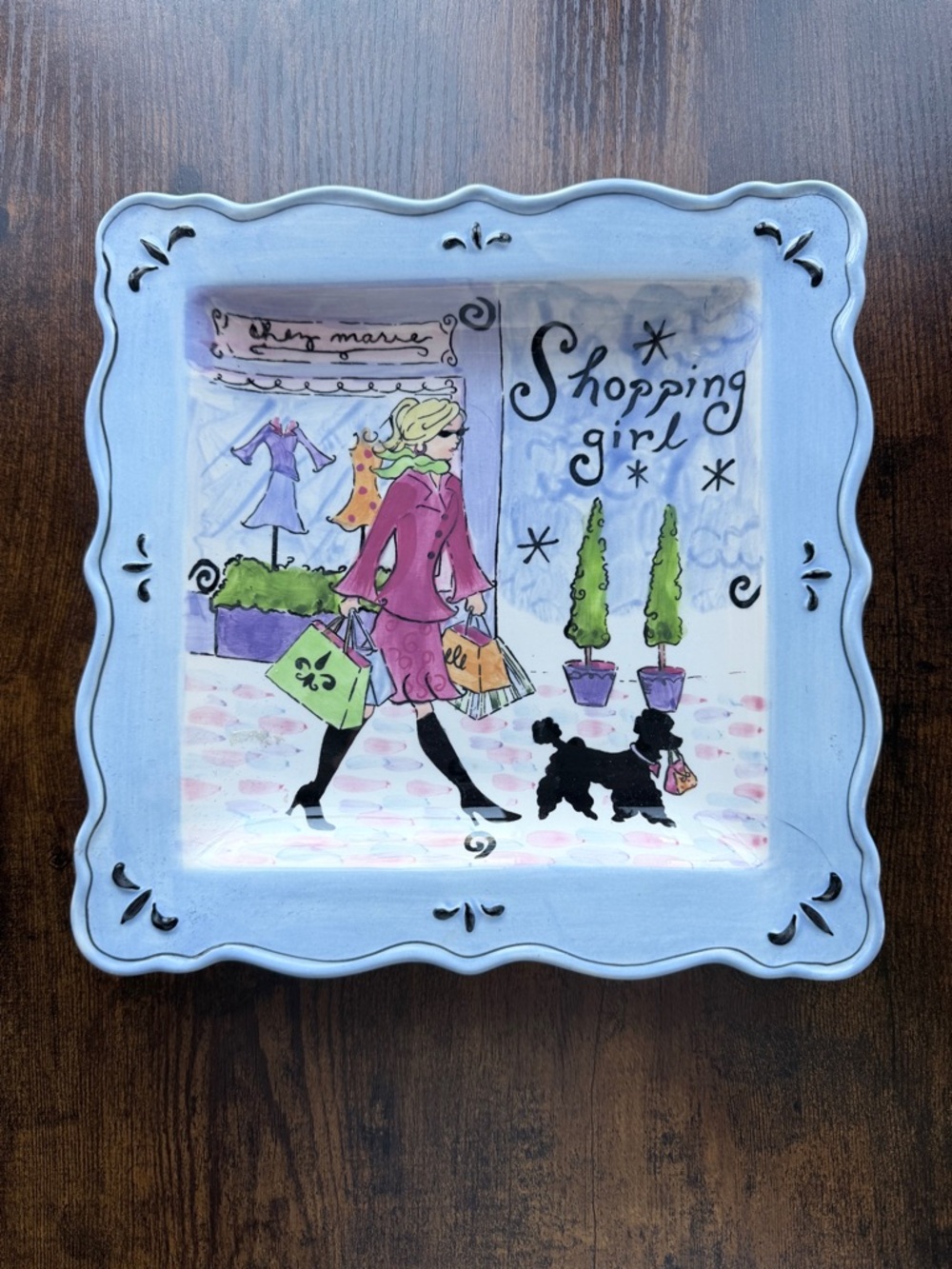 Shopping Girl plate by Jennifer Brinley. Approximately 9x9 inches.